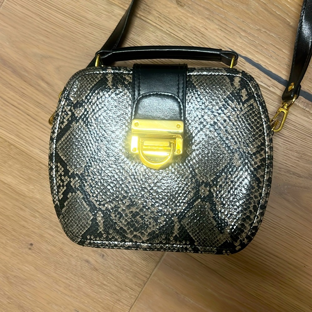 BAGS BY MARLO black snake skin looking evening bag gold color details. Sits up.